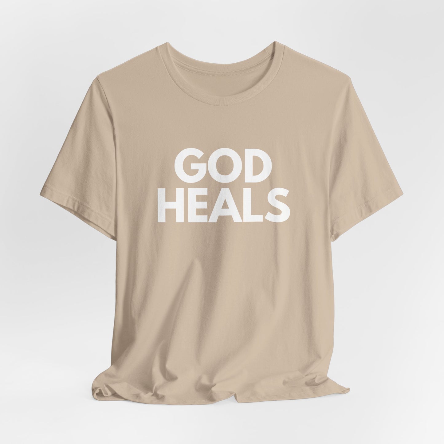 GOD HEALS Bold Statement Tee – Faith Over Fear Collection