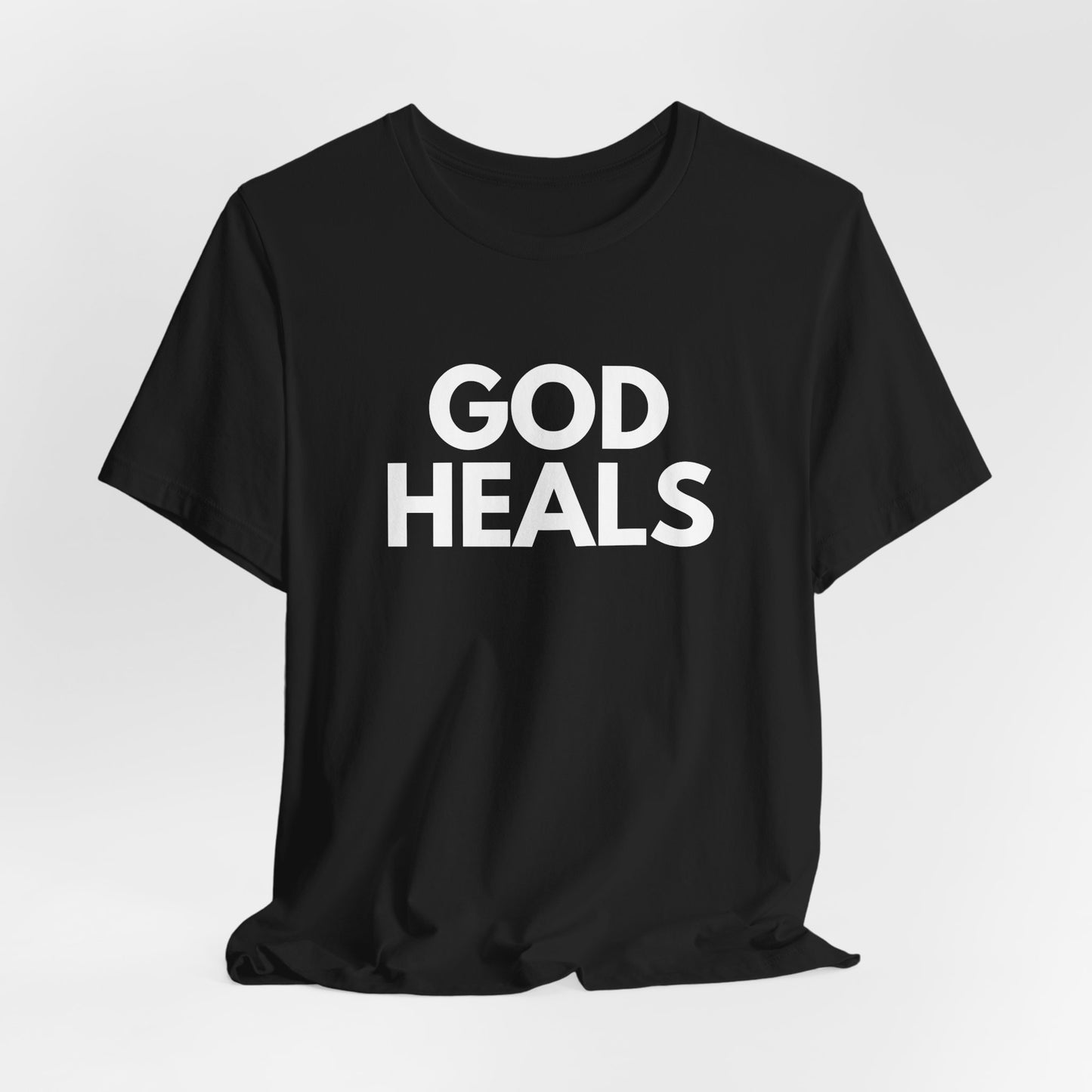 GOD HEALS Bold Statement Tee – Faith Over Fear Collection